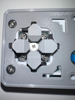 The split D-pad — four independent directional buttons